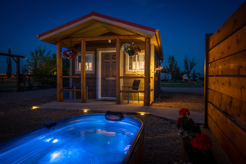 Cabin exterior with private patio and fire pit