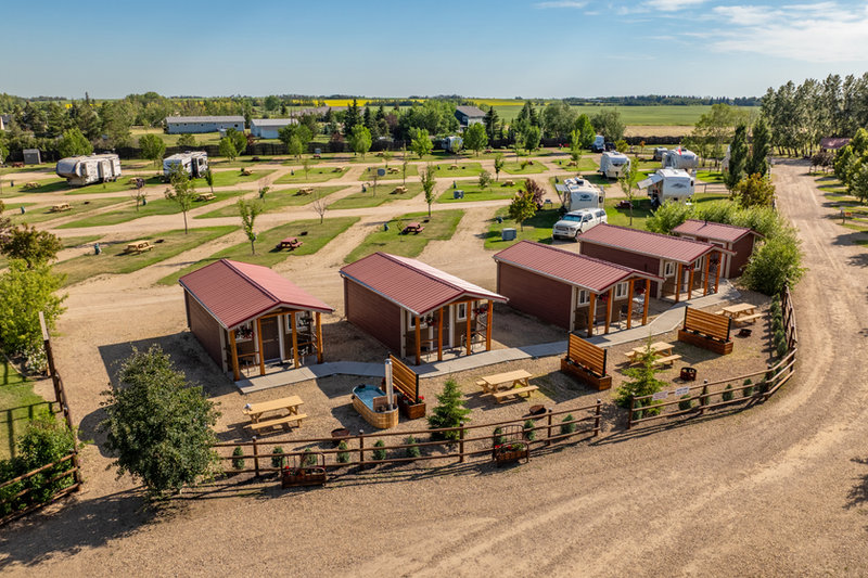 Themed rustic cabins at Prairie Junction RV Resort