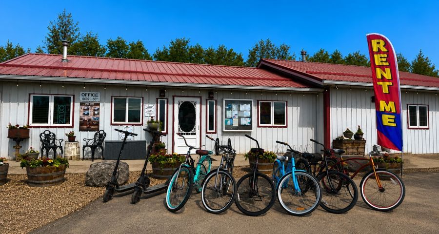 The Prairie Junction rentals shop with e-scooters and cruiser bikes out front